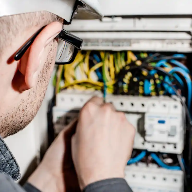 Electrician working on consumer unit